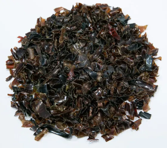 Brown hot-washed PET flakes