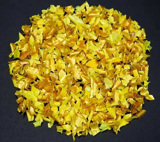 Yellow hot-washed PET flakes